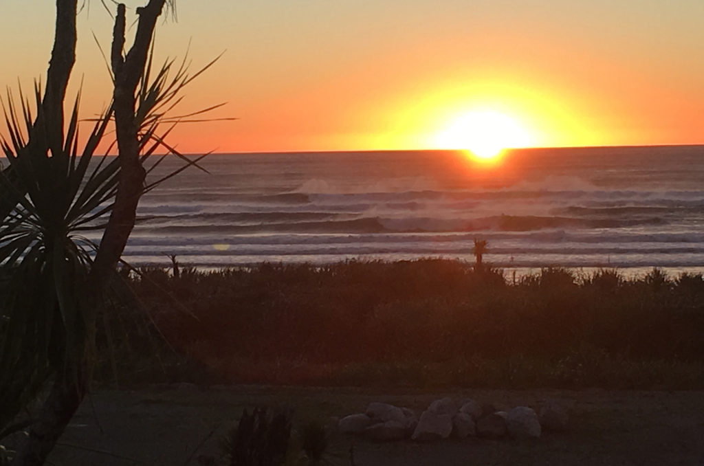 sunset near pnacake rocks new zealand