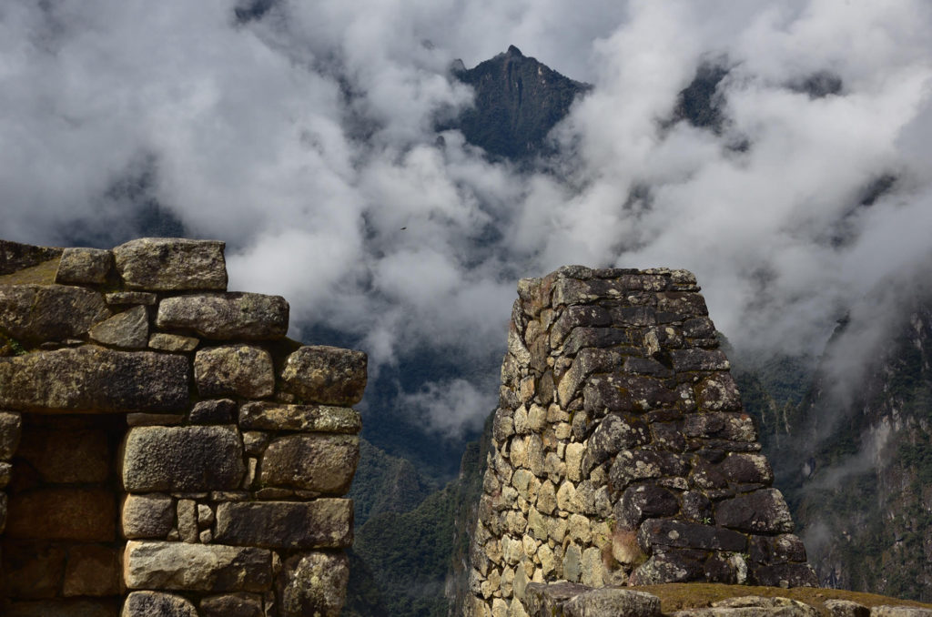 mountain overlooking stone wall machu picchu