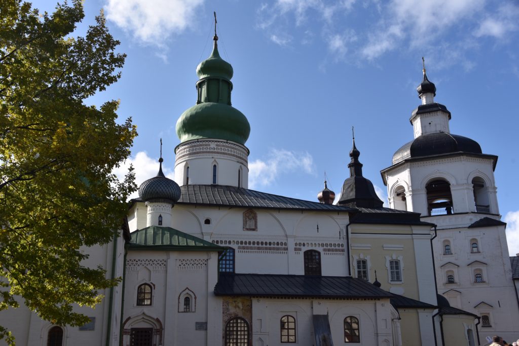 green and black roofs with crosses