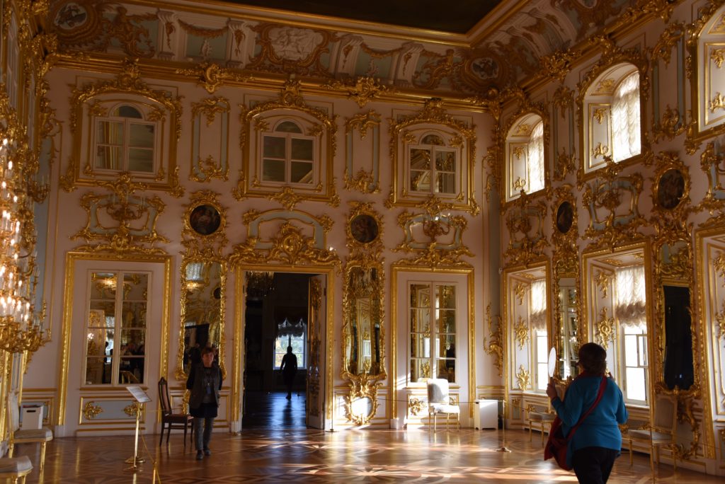 inside building with gold frames