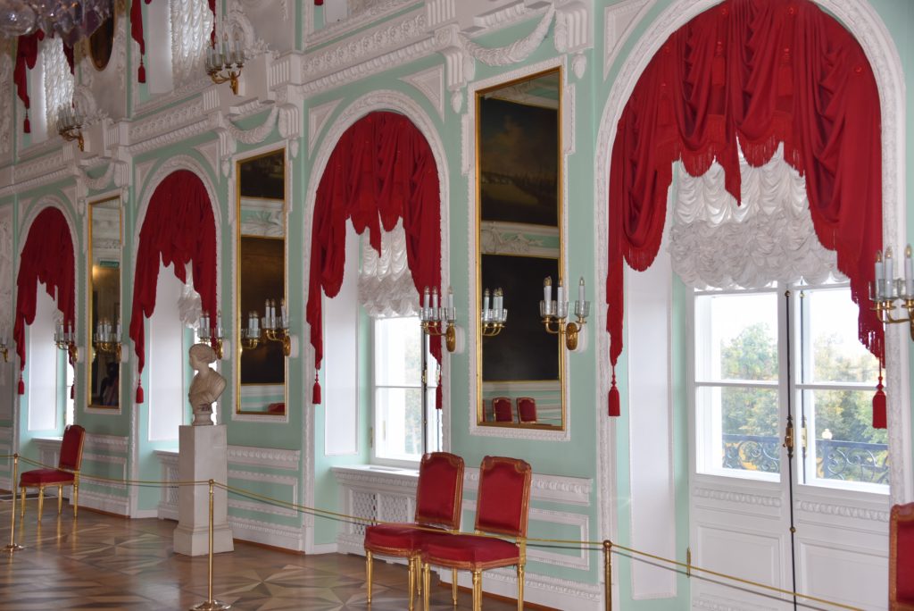 red curtains and red chairs in building