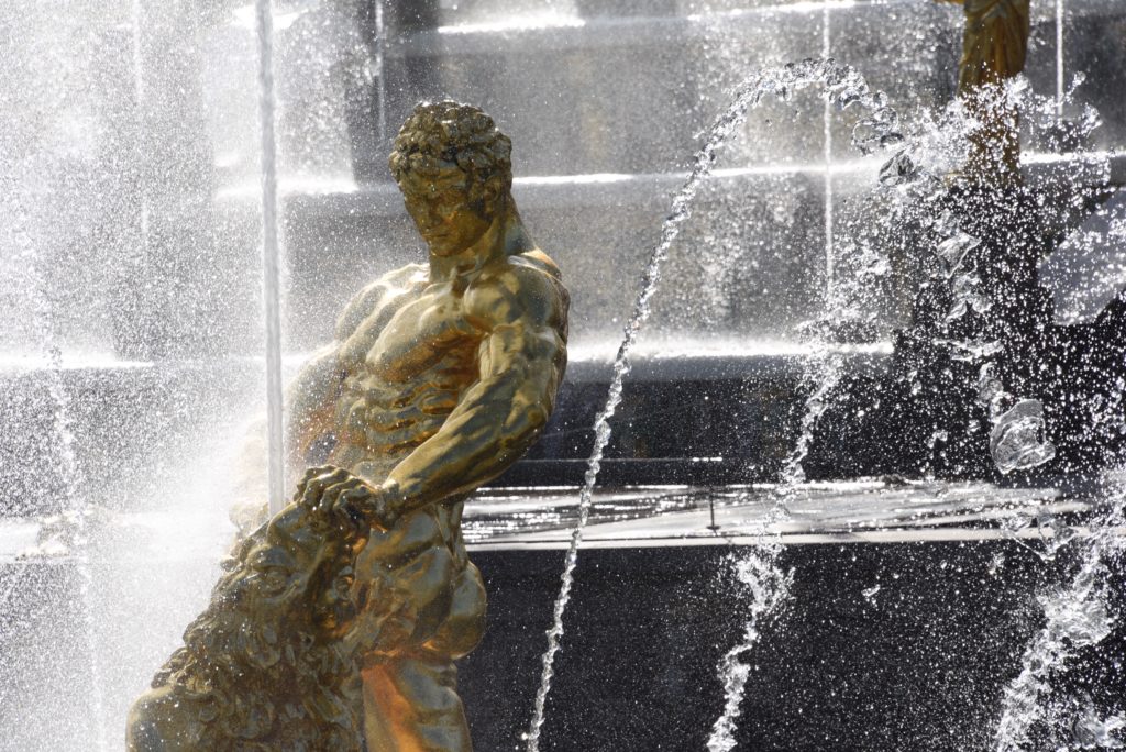 close up of gold guy statue