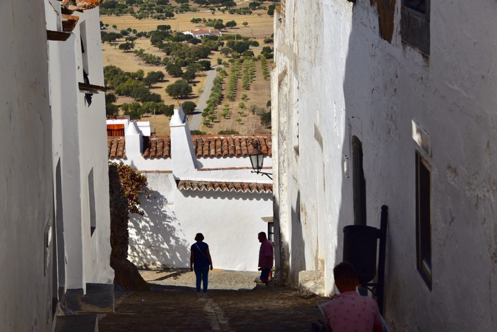 people standing in alleyway