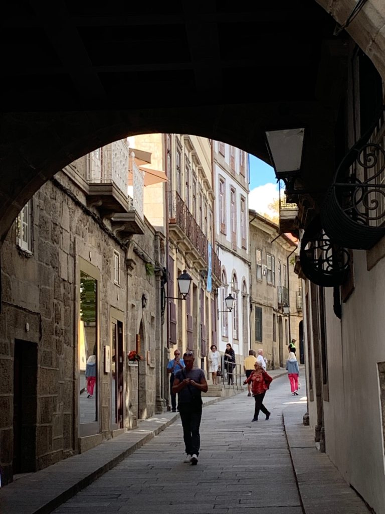 people waking through tunnel way