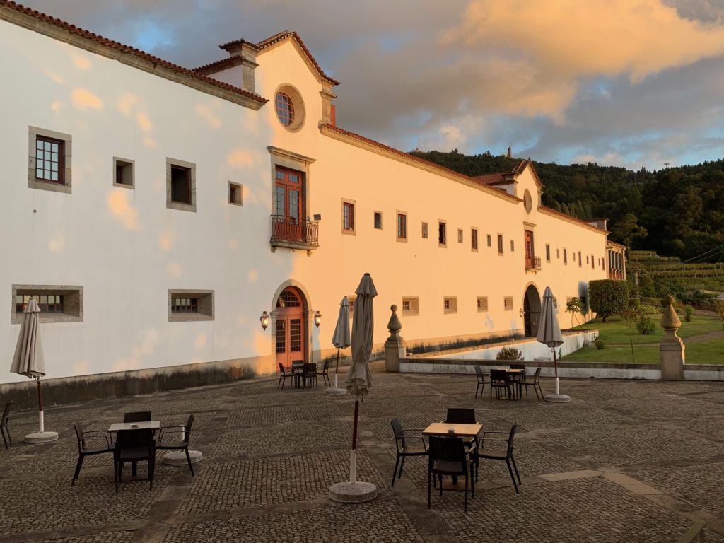 close umbrella outside with tables and chairs