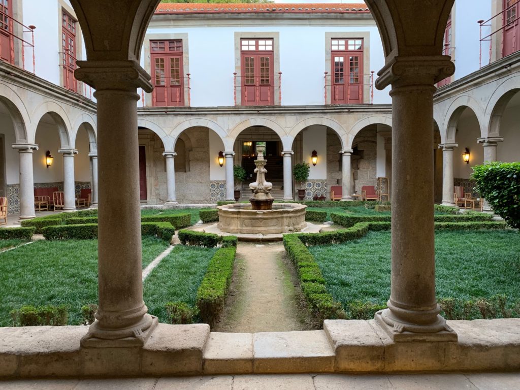 water fountain with bushes