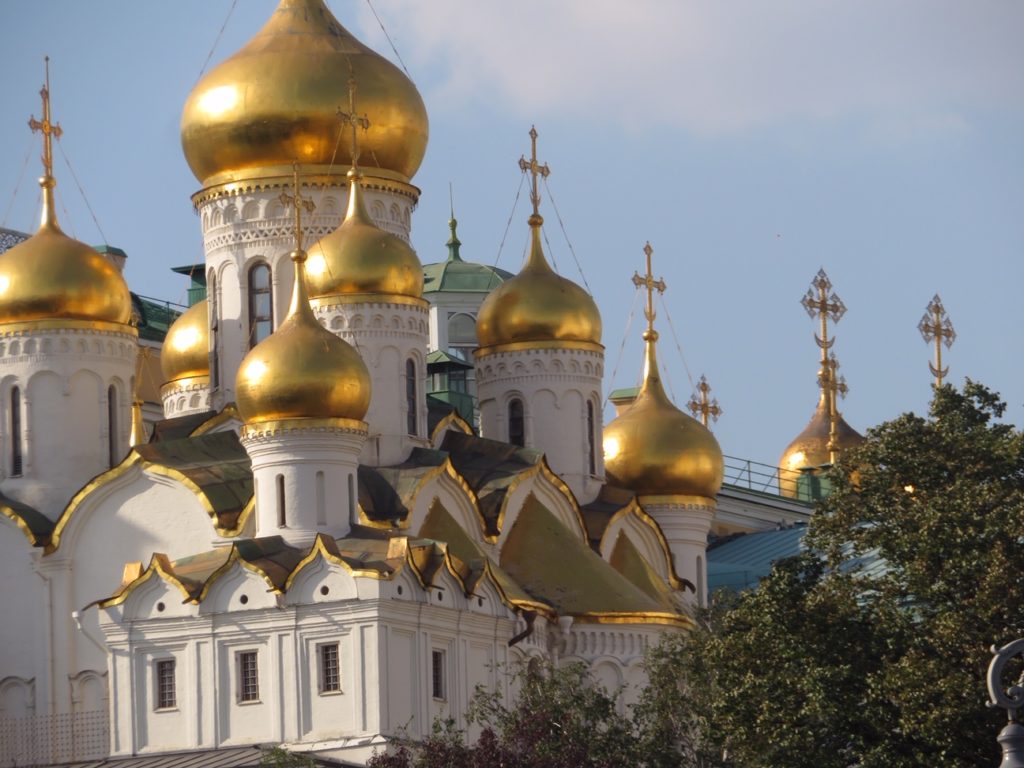 white building with gold tops