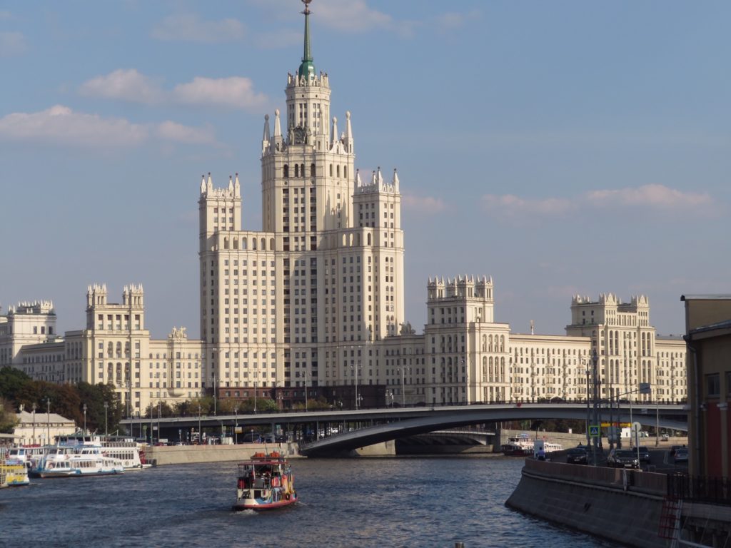 huge building next to bridge and river