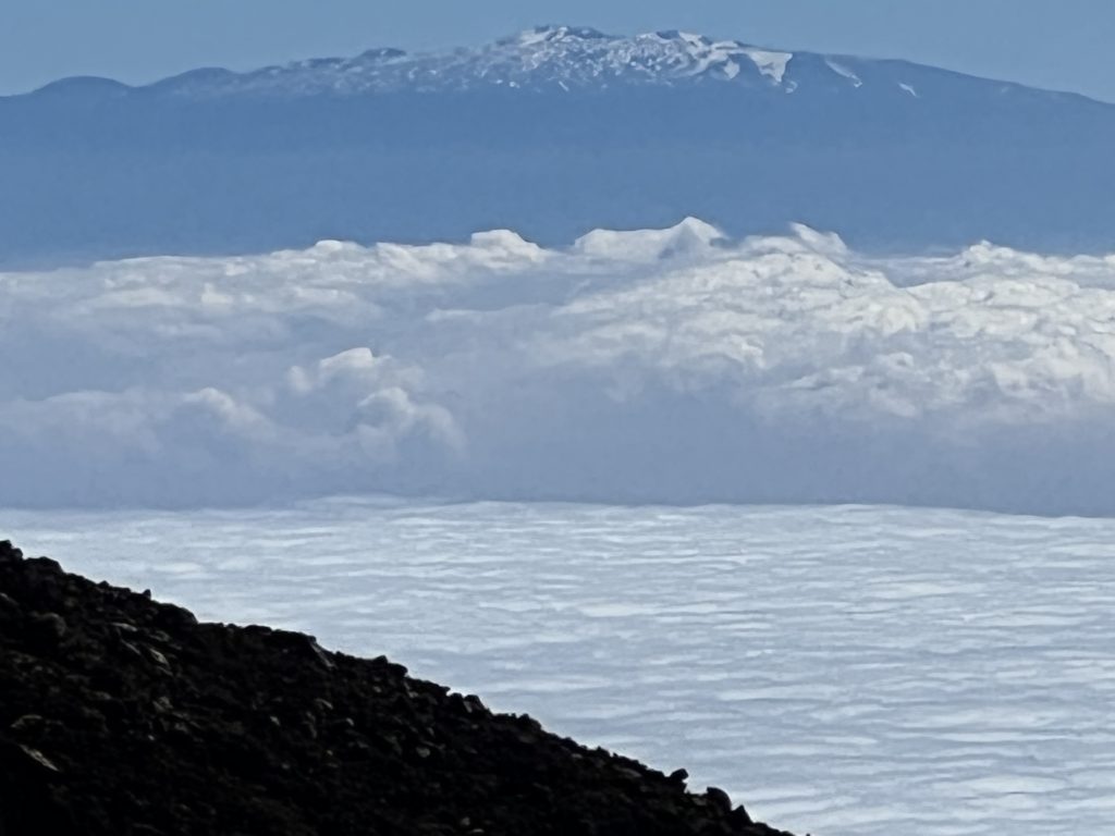 Clouds with Maura Kea Mountain on the Big Island in the Background